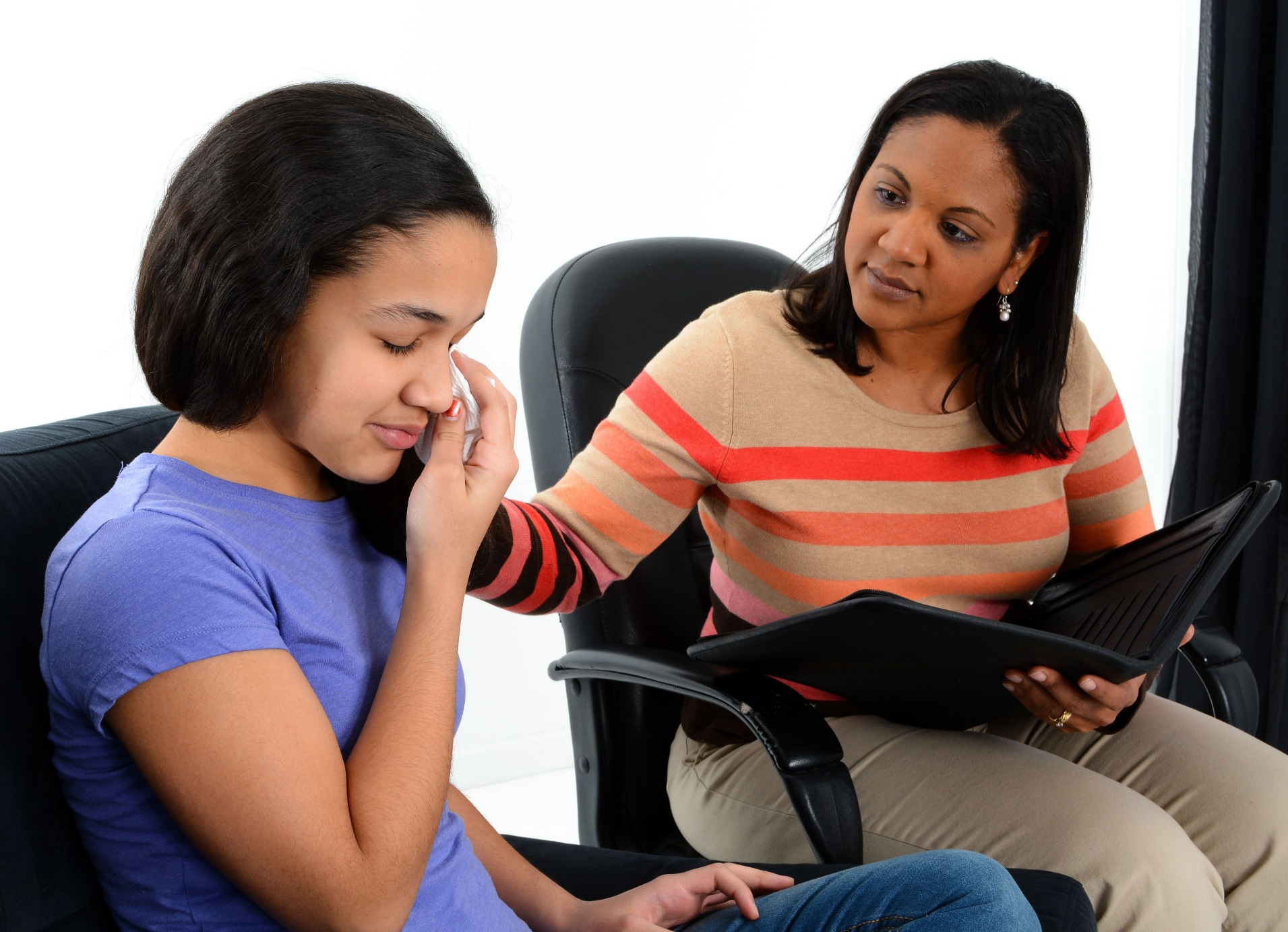 Therapist and depressed child talking